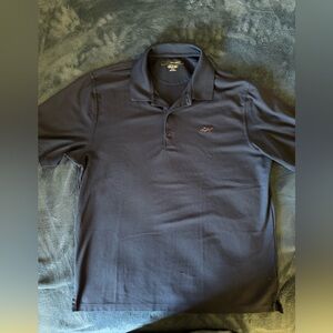 Greg Norman 
Navy Polo Shirt